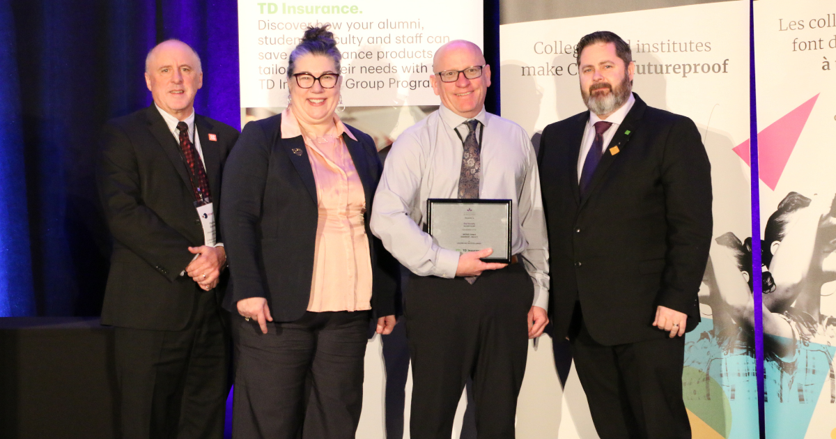 Ray Murphy accepts his award from CICan and partners.