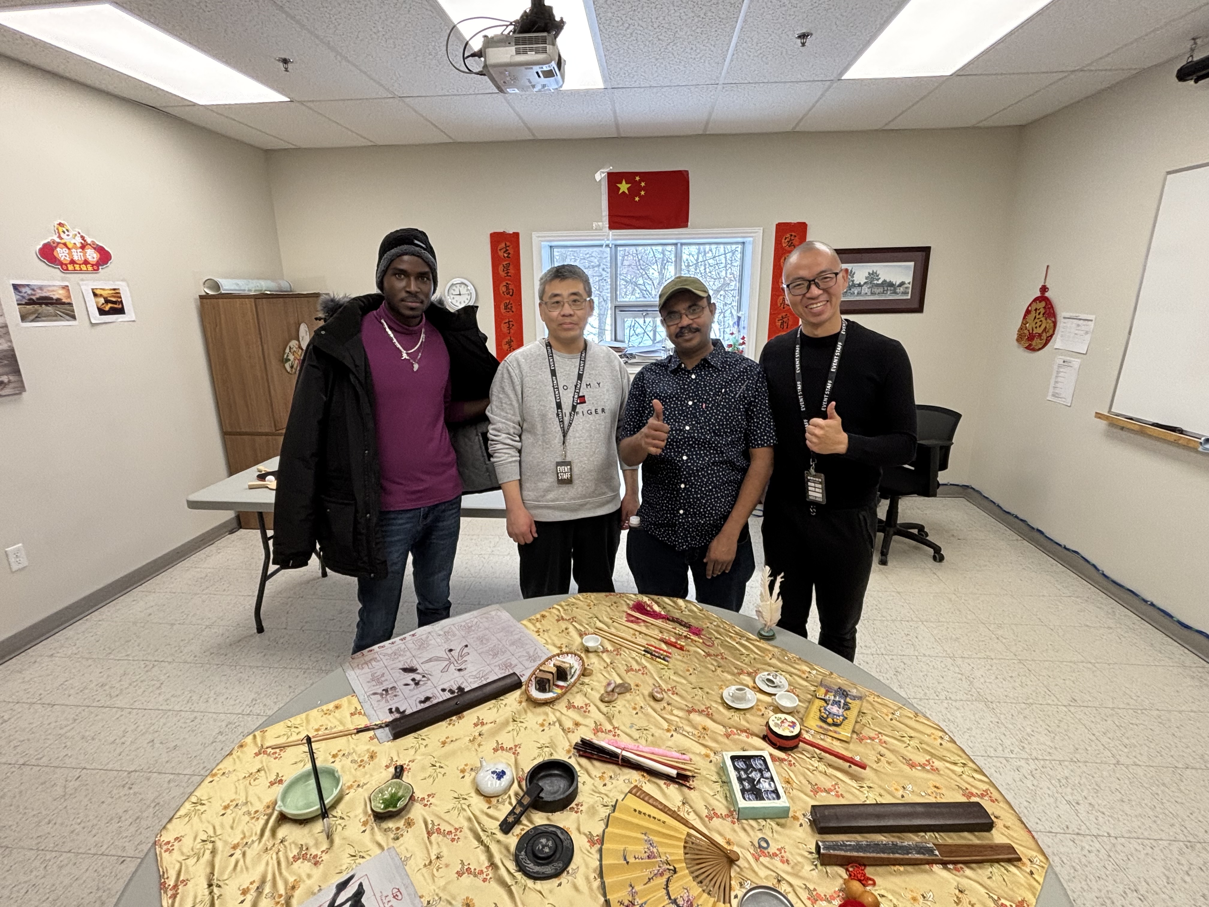 Qi Wang and Michael Xie, present a writing challenge and a display of cultural items and information about the Chinese New Year. 