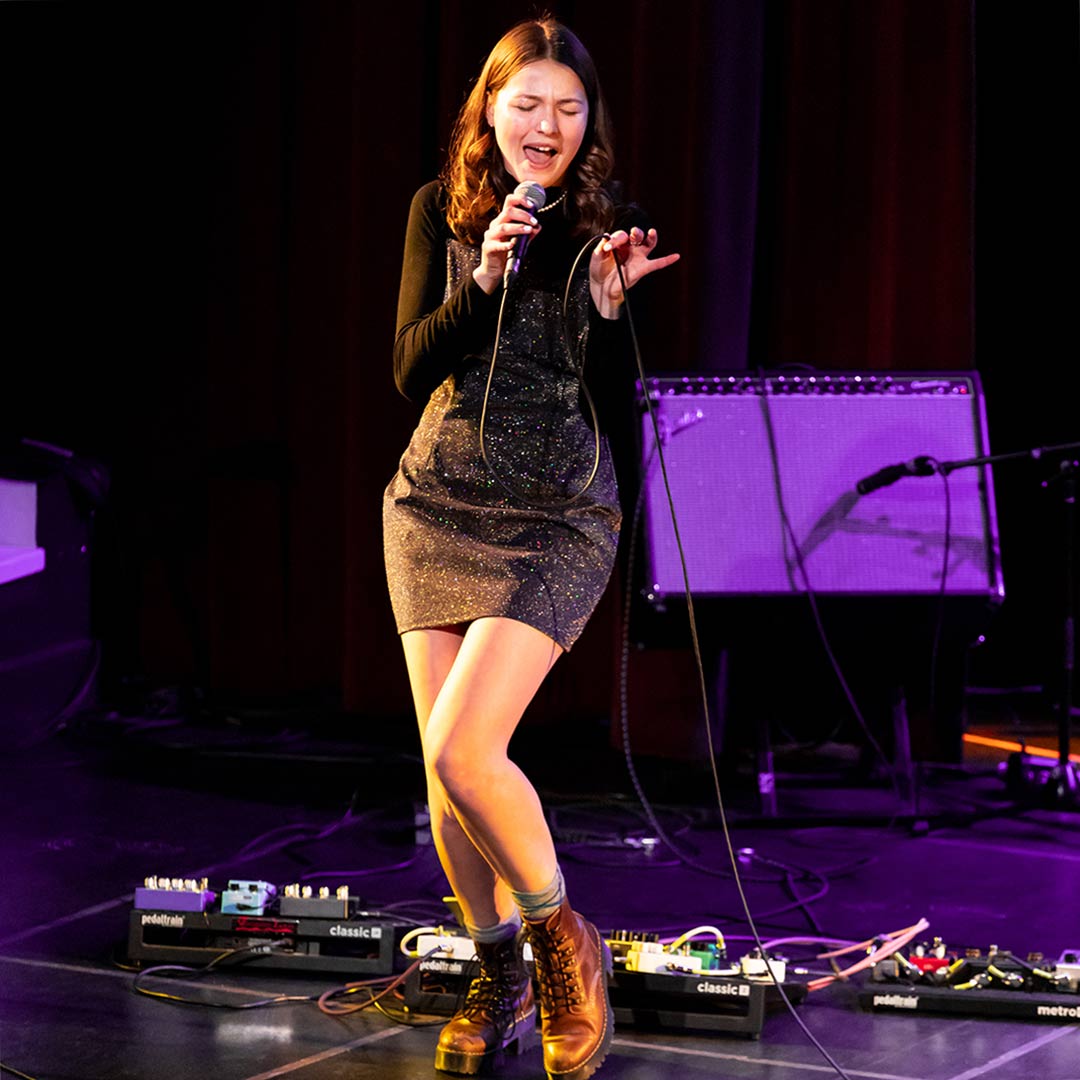 Lucia performing in concert at the Florence Simmons Performance Hall