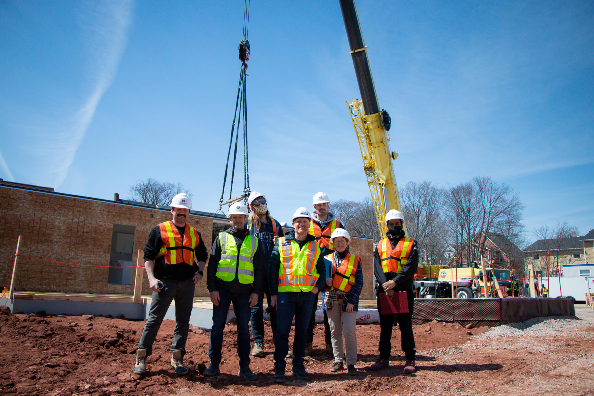 The project Management class poses with the 720 Solutions Team at the construction site