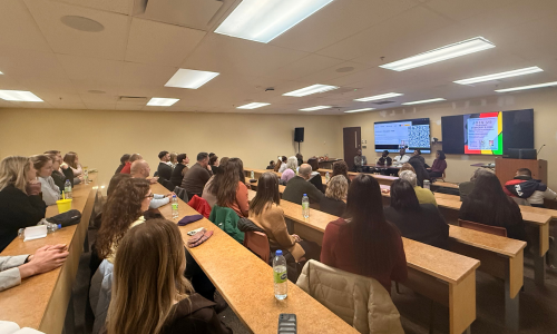 A classroom lecture theatre with attendees for the black history month panel discussion