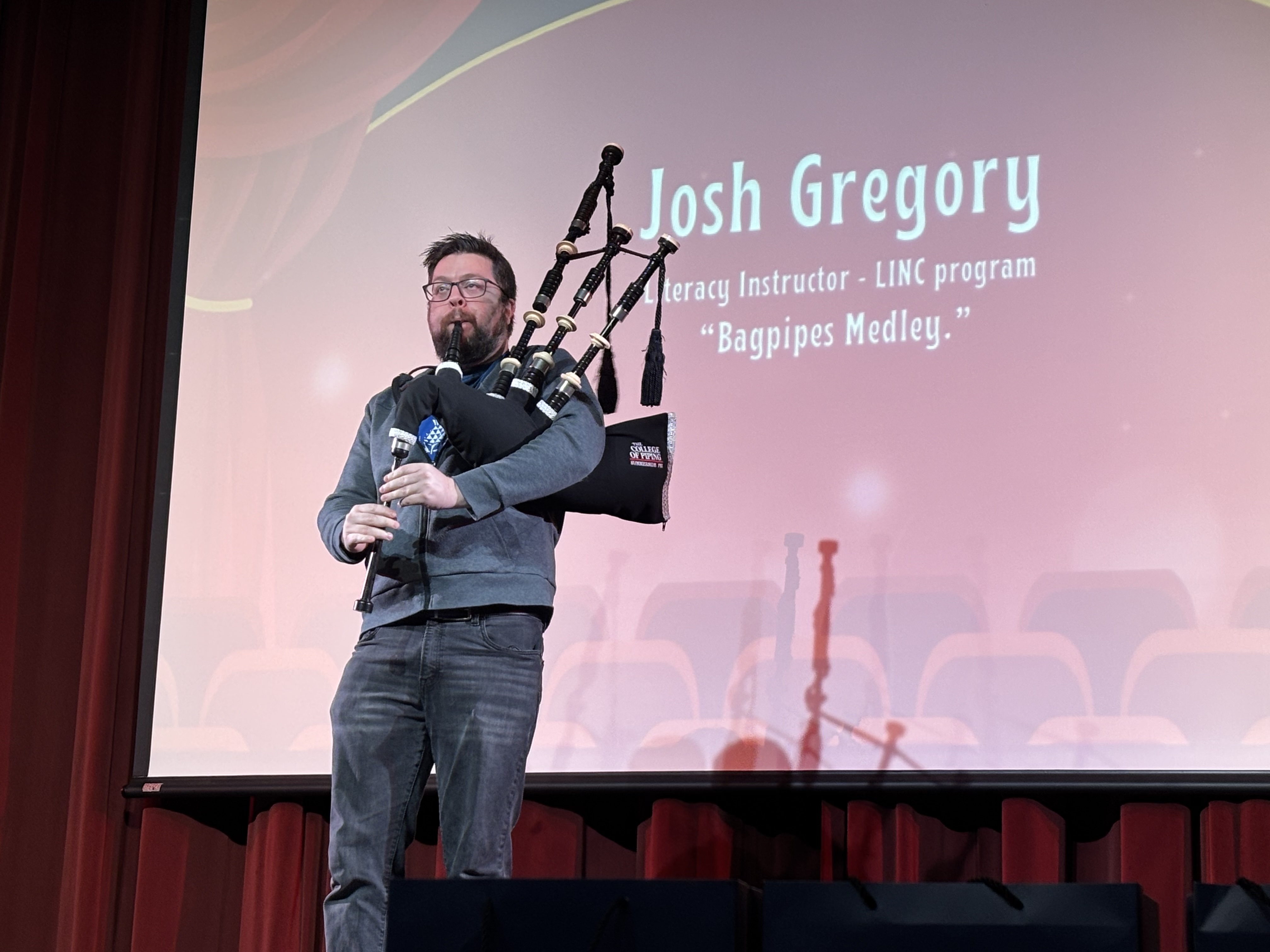 LINC instructor Josh Gregory performs with bagpipes at LINC's talent show