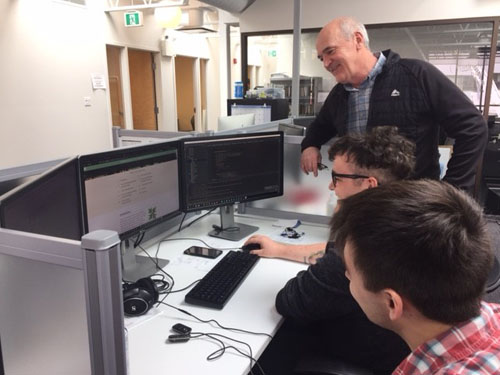 CPKN president Sandy Sweet looks over the development of the training modules with Evan Jackson and Chris MacEachern (left). Both Jackson and MacEachern are Holland College graduates. Photo: Sidney Reid.